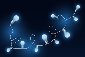 Blue glowing garland of light bulbs. On a dark background