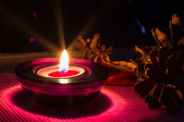 purple candle and Christmas lights