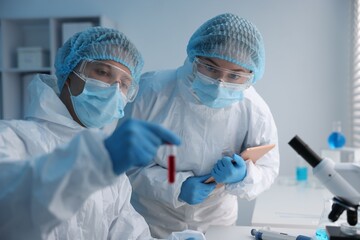 Medical analysis. Scientists working with blood sample in laboratory