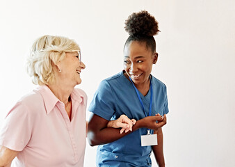 Doctor or nurse caregiver helping disabled senior woman walking down the stairs at home or nursing...