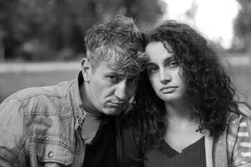 Portrait of homeless people outdoors. Black and white effect