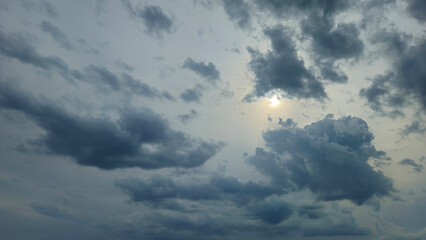 Dark blue clouds and sunlight in the sky