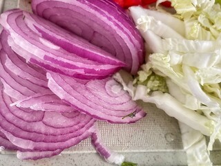 red onion on a wooden board