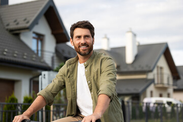 Bearded caucasian young man on a bike looking confident