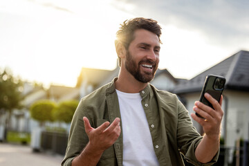 Smiling confident man talking via video and asking about the route