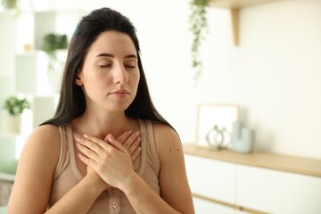 Panic attack. Woman breathing to calm down at home, space for text