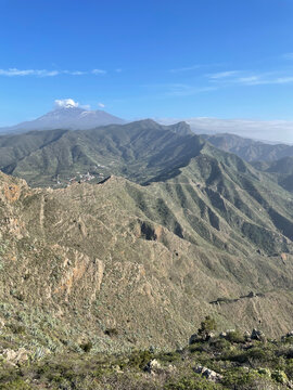 Natural Park in Tenerife with Lush Green Mountains and Distant View of Mount Teide &ndash; Scenic Landscape Capturing the Island&rsquo;s Wild Beauty and Volcanic Majesty under a Bright Sky