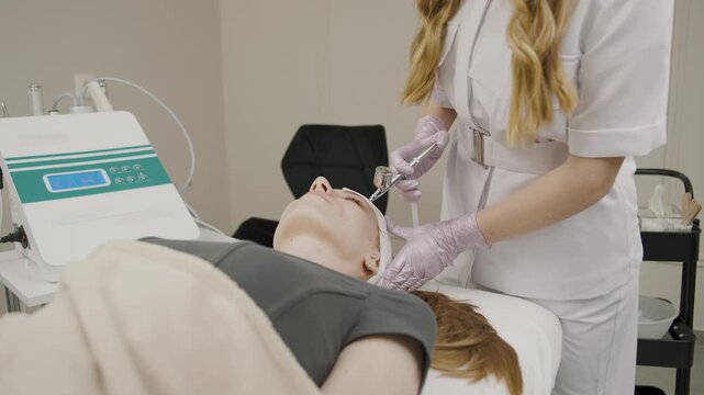 Cosmetology session showcasing permanent makeup application by a skilled technician