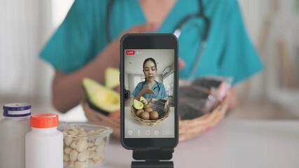 Asia woman people anti aging expert modern health care vlogger live advice talk selfie video mobile phone camera. Online diet food weight loss HDL meal plan recipe digital virtual asian coach filming.