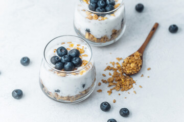 Yogurt granola parfaits topped with fresh blueberries