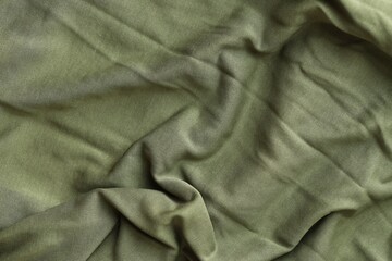 Background texture of camouflage khaki green color military uniform fabric