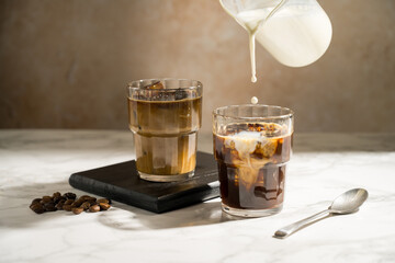 Glass with iced latte, refreshing energy coffee drinks