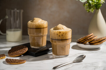 Glass with latte, refreshing energy coffee drink with foam