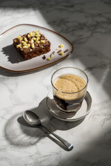 Black hot coffee in a glass, sunlight, lifestyle photo