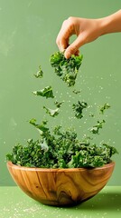 Fresh kale being tossed in a wooden bowl for a healthy meal.