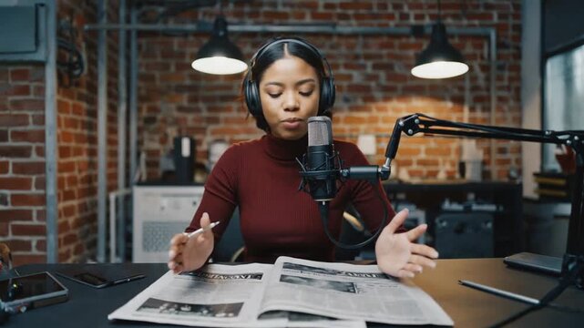 Reading the newspaper on the radio.