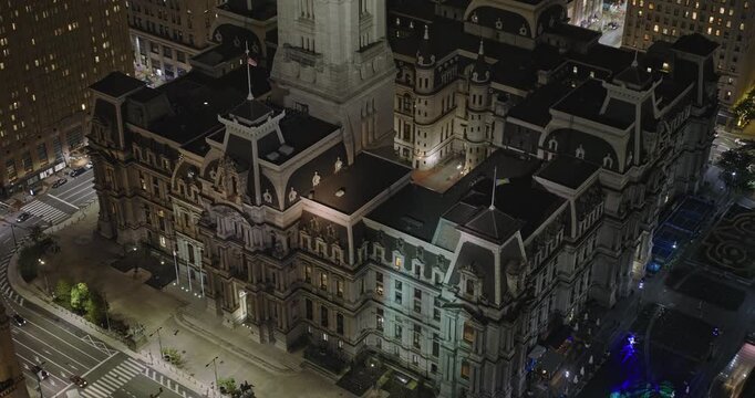 Philadelphia Pennsylvania Aerial v127 reverse flyover city center, capturing City Hall, a grand historic landmark shining amidst towering skyscrapers at night - Shot with Inspire 3 8k - Sept 28th 2023