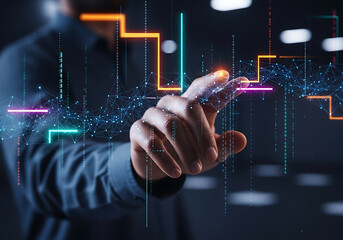 A businessman's hand points at a glowing digital graph, analyzing financial data on a virtual interface.