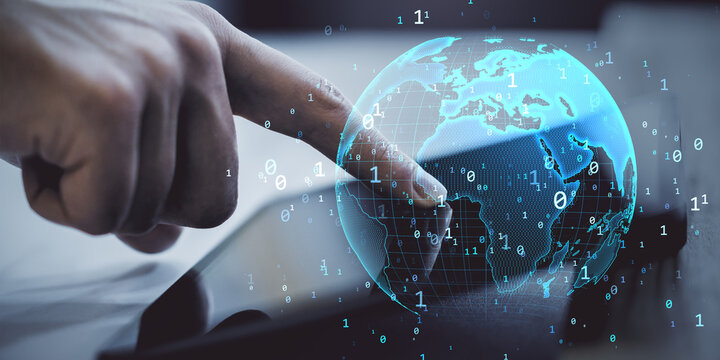 Futuristic hand interacting with digital hologram world map over tablet screen in cyberspace concept of global network and smart data access.