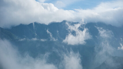 Fog flowing on hills and sky