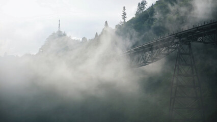 Fototapeta premium Fog flowing on the monorail funicular track