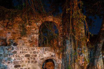 Weathered ruins of an old structure, showing decay, history, and forgotten beauty.