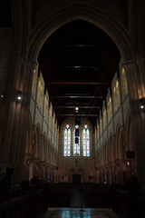 Fototapeta premium Photographs showing the inside of a grand Bermudian church with stone walls, tall arches, and detailed architecture