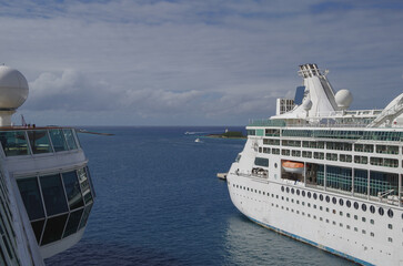 View from outdoor deck of cruiseship cruise ship liner onto rear part of other vessel in port of...