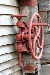 Blacksmith's hand drill on a log wall