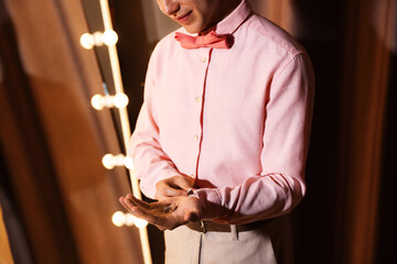 Man with cufflinks getting ready indoors, closeup