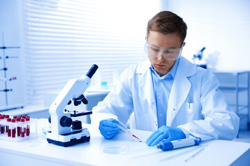Medical analysis. Scientist working with blood sample in laboratory