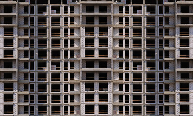 Construction of buildings, a multi-story building against the sky