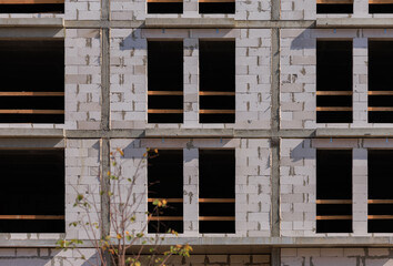 Construction of buildings, a multi-story building against the sky