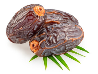 Semi-dried dates or date palm fruits lie on palm leaves isolated on white background. File contains...