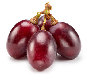Ripe red table grape berries on white background. File contains clipping path.