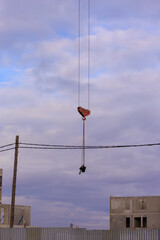 Construction of buildings and high-rise cranes against the sky
