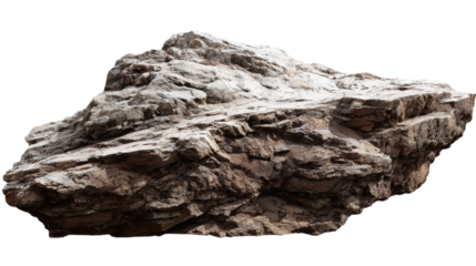 A rugged rock formation with a textured surface and varying shades, showcasing natural geological patterns.