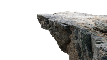 A rugged rock formation juts out dramatically against a black background, showcasing its textured surface and natural beauty.