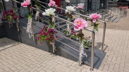 Vibrant and Colorful Floral Decorations Gracefully Adorning the Modern Staircase Design