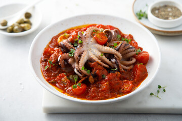 Octopus with tomato sauce and capers