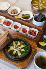 Abalone rice porridge, mackerel, salad, traditional Korean starters in a restuarant 