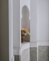 Elegant interior with a vase of dried flowers.