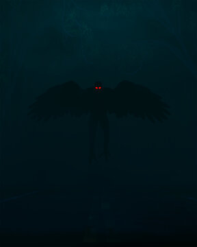 The Mothman Cryptid with red wings and outstretched wings on a foggy road