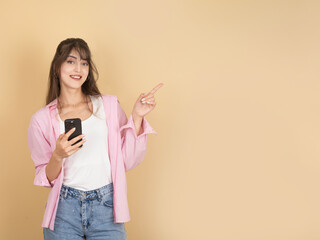 Special online offer concept. Portrait of young caucasian  brunette 20s woman holding using mobile...