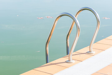 Leisure and recreation at a backyard or community pool.