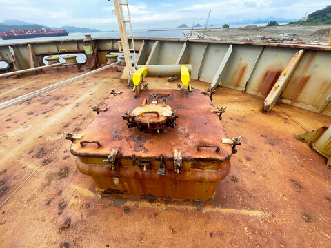 Access hatch to forepeak compartment of the cargo ship in very poor condition with heavy corrosion