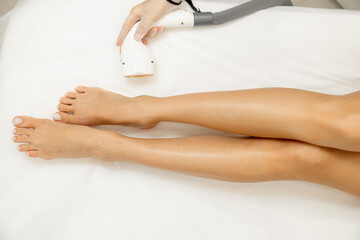 Laser hair removal and cosmetology in a beauty salon. Hair removal procedure. The concept of laser...