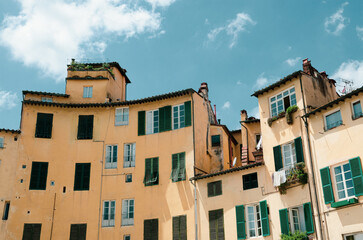 Mediterranean architecture with green shutters in the historic town of Lucca