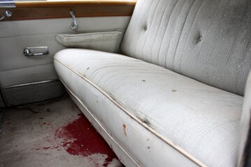 Vintage car back seat, faded upholstery, stains