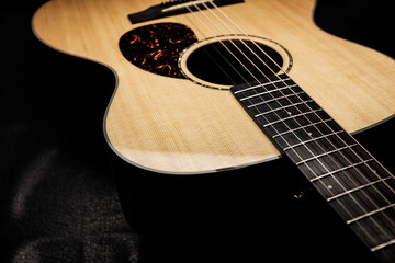 acoustic guitar on black background
